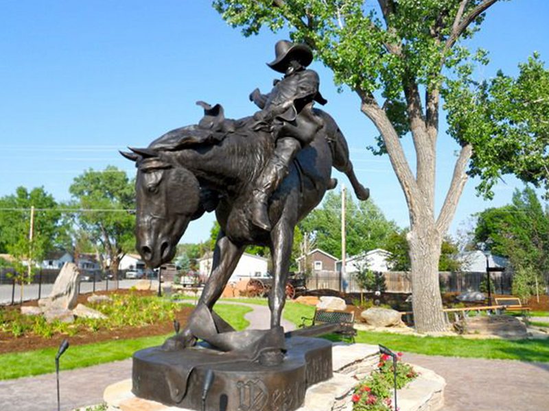 bronze cowboy statue