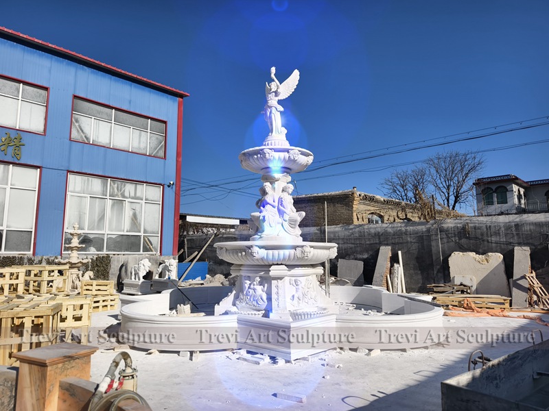 marble outdoor fountain with angel statue