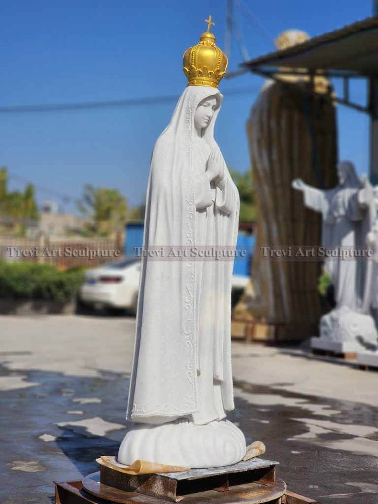 Outdoor white virgin mary statue with gold crown
