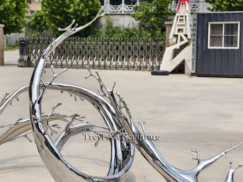 Modern stainless steel water splash sculpture detail