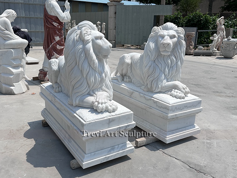 stone lion statue in front of house