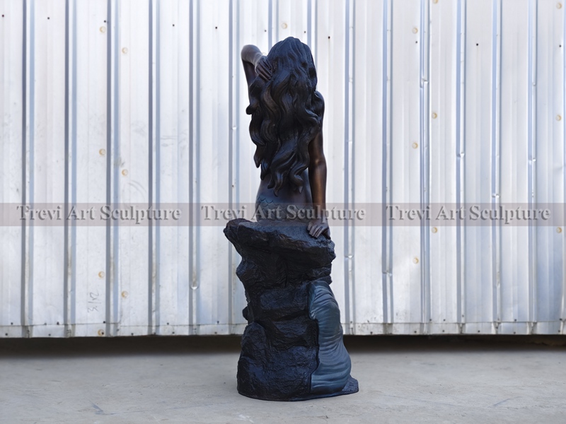Bronze mermaid statue detail