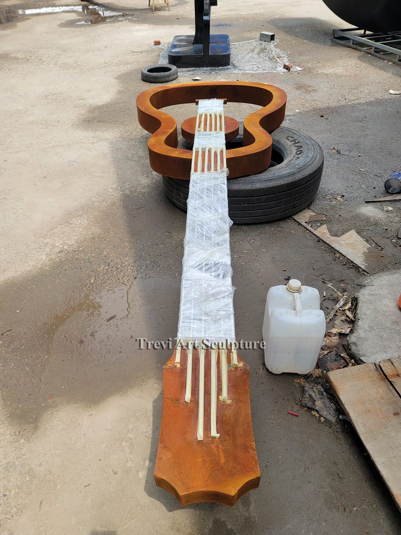 Corten guitar sculpture trevi