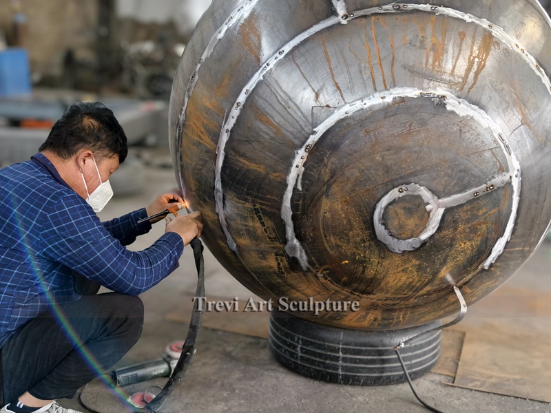 corten steel sphere sculpture process