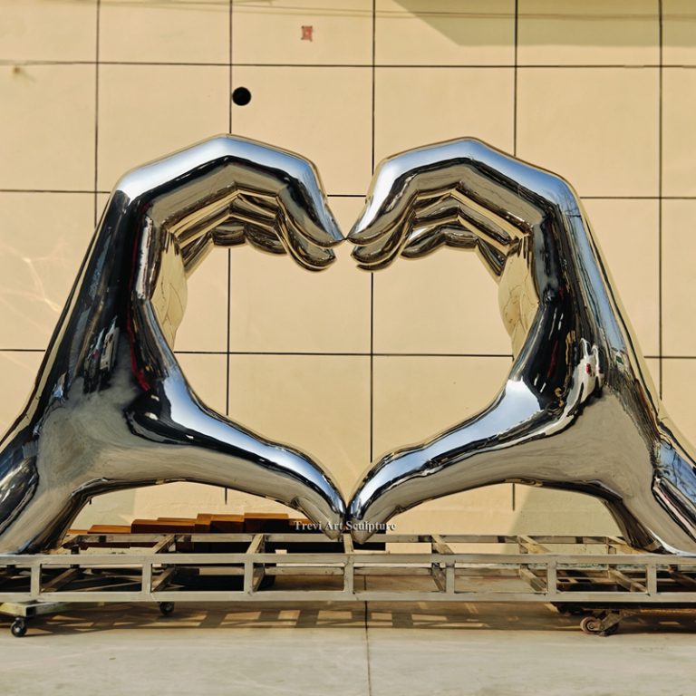 giant heart shape hand statue