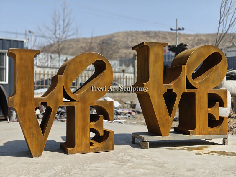 Corten steel love letter sculptures