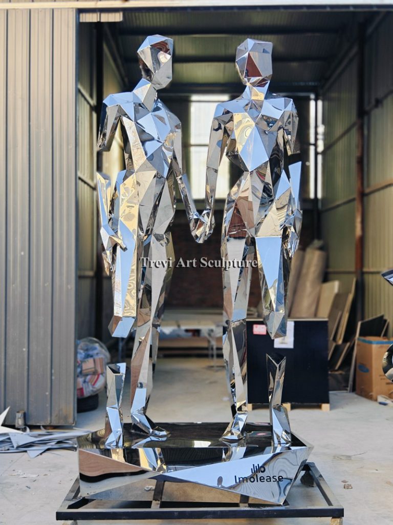 10 feet broken but together stainless steel sculpture