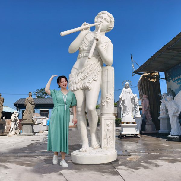 large Statue of a Woman Playing the Flute